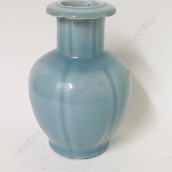 A Chinese porcelain vase glazed in pale blue monochrome
