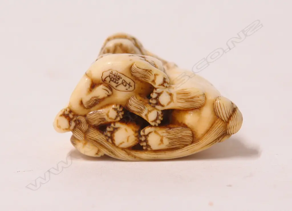A 19thC Japanese finely carved ivory shishi figure group netsuke Image 1++