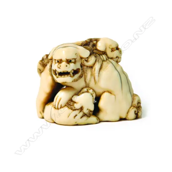 A 19thC Japanese finely carved ivory shishi figure group netsuke