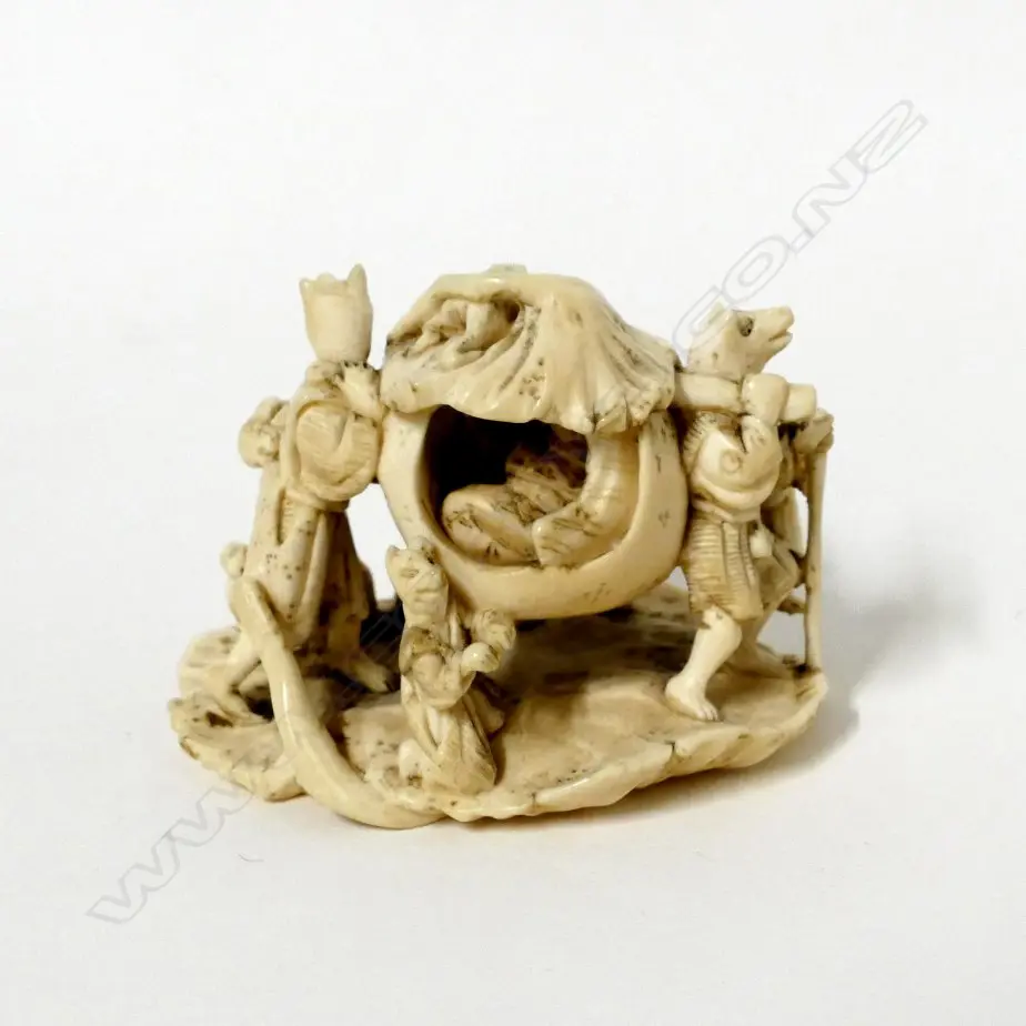 An old Japanese carved ivory okimono depicting a folktale Image 1++