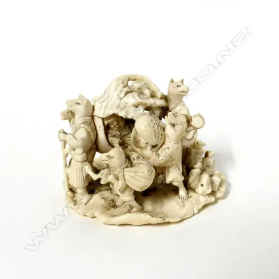 An old Japanese carved ivory okimono depicting a folktale