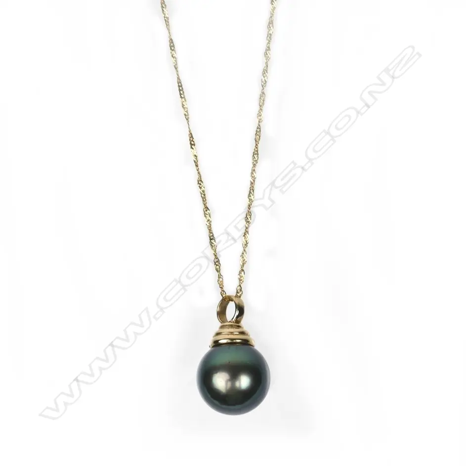 A 9ct. gold and black pearl pendant Image 1++