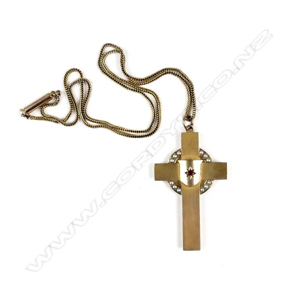 A 9ct. rose gold cross and chain Image 1++