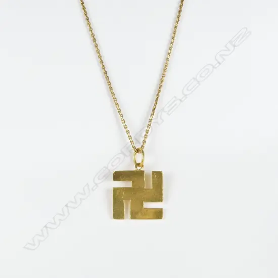 A 20ct. gold swastika pendant