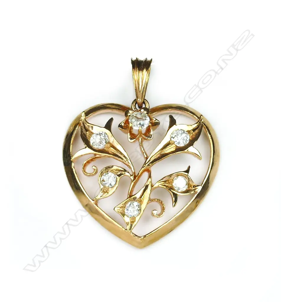 A 20ct. rose gold and diamond set heart pendant Image 1++