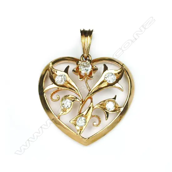 A 20ct. rose gold and diamond set heart pendant