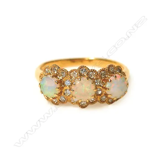 An 18ct. yellow gold opal and diamond cluster ring