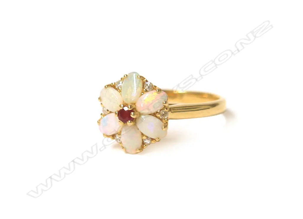 An 18ct. yellow gold opal ruby and diamond flower head cluster ring Image 1++