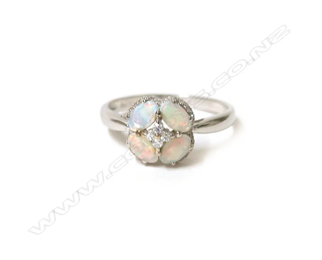 An 18ct. white gold opal and diamond lady's dress ring Image 1++