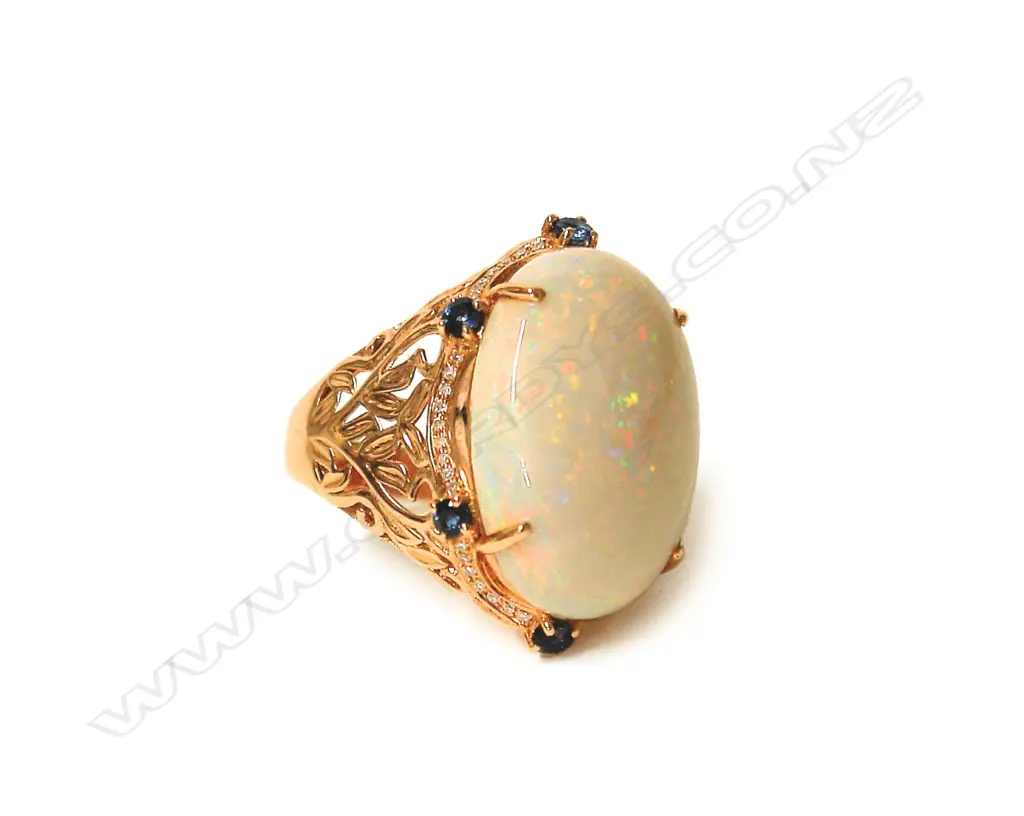 An 18ct. rose gold large opal sapphire and diamond dress ring Image 1++