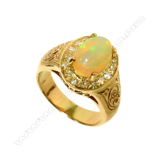 An 18ct. rose gold set opal and diamond dress ring