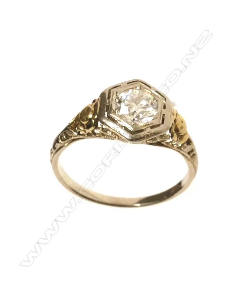 An estate 18ct. yellow and white gold 0.50ct diamond solitaire ring Image 1++