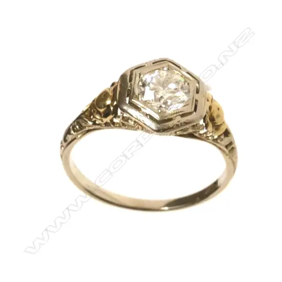 An estate 18ct. yellow and white gold 0.50ct diamond solitaire ring