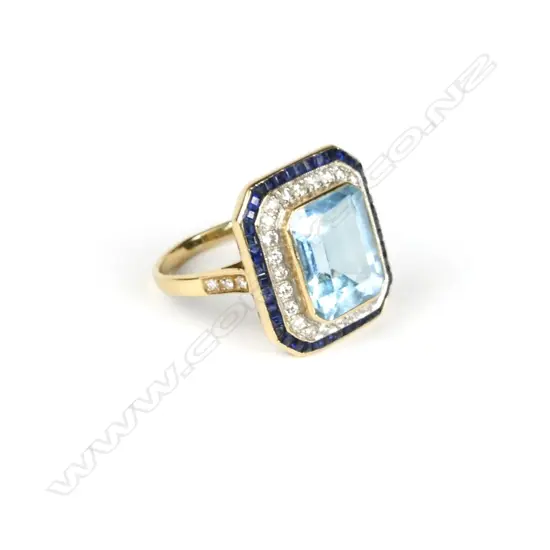 An 18ct. gold aquamarine sapphire and diamond Deco style ring