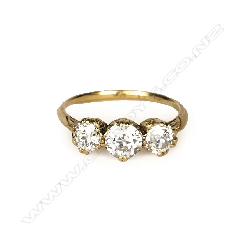 An estate 18ct. gold and three stone diamond ring Image 1++