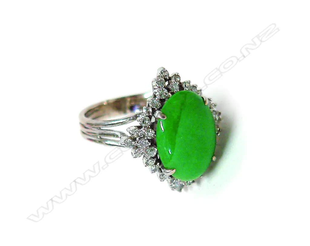 A modern 14ct.(approx.) white gold jadeite and diamond cluster ring Image 1++