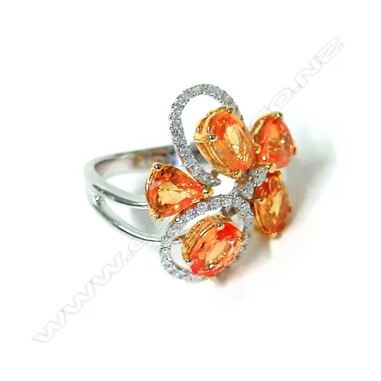 An 18ct. white gold and yellow sapphire dress ring