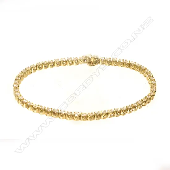 A 9ct yellow gold tennis bracelet set with 56 round brilliant cut diamonds