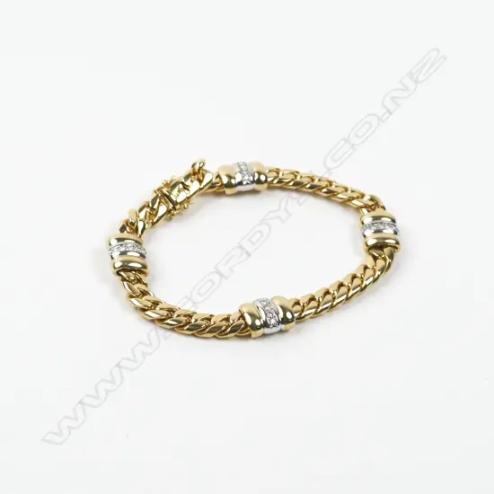 A heavy 18ct. gold and diamond bracelet