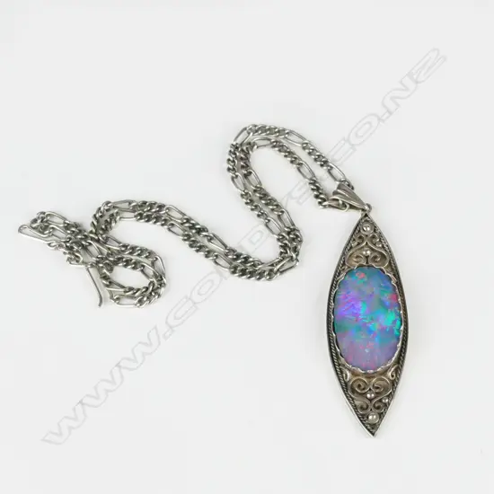 A Reuben Watts silver and opal pendant