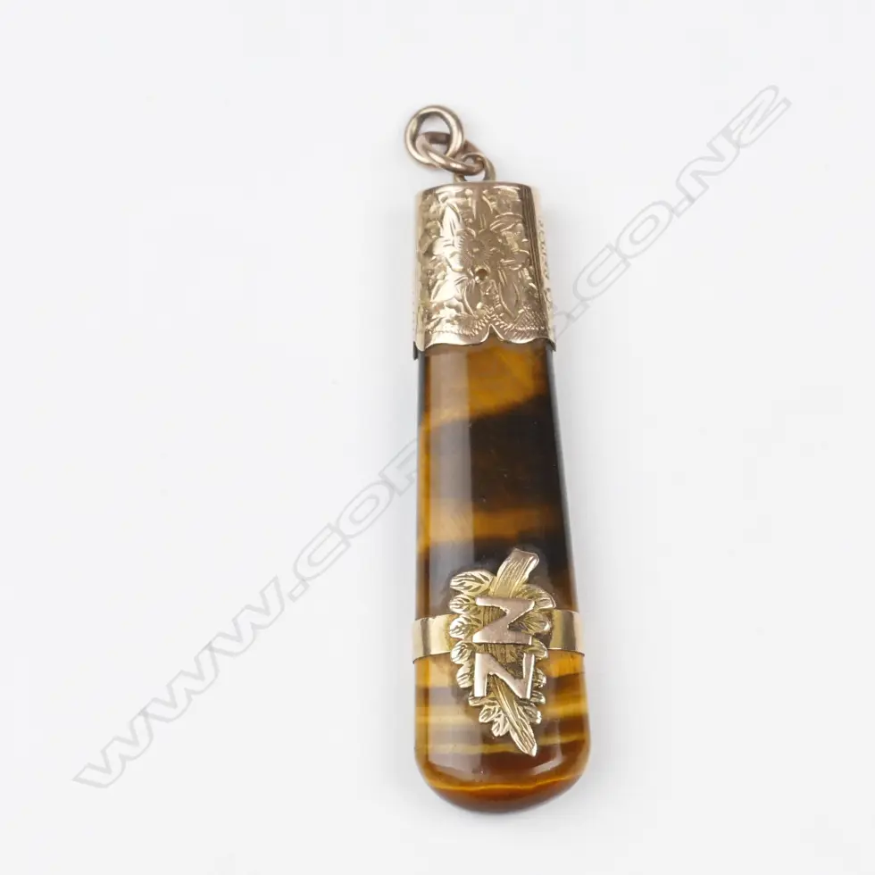 A colonial 9ct. rose gold and tiger's pendant Image 1++