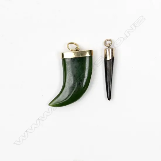A 9ct. gold and pounamu tusk shaped pendant