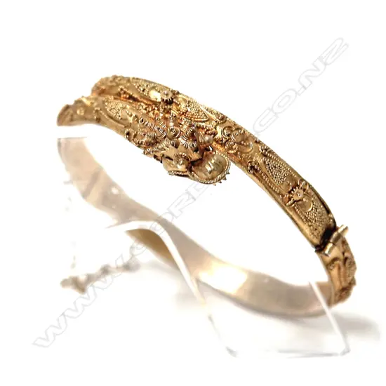 An early 20thC Chinese silver gilt half-hinged bangle