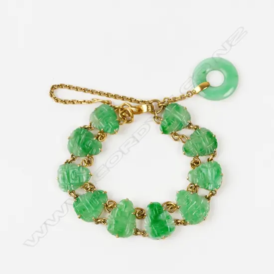 A 22ct. gold and jade bracelet