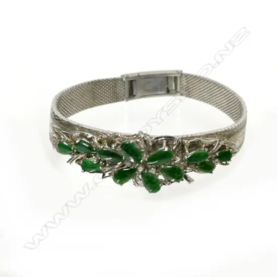 A 9ct. white gold and jade bracelet