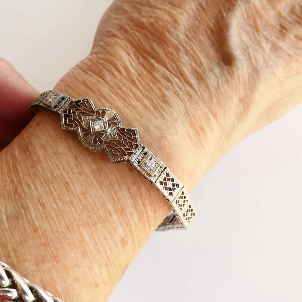 A vintage Art Deco style 14ct. white gold and diamond bracelet. 10.43gms Image 1++