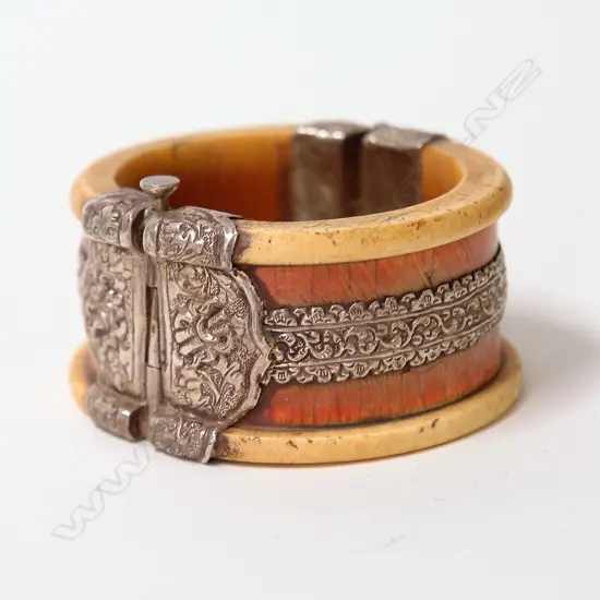 An old Indian ivory and silver hinged bangle