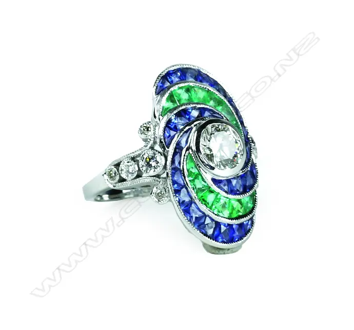 An 18ct. white gold emerald sapphire and diamond dress ring Image 1++