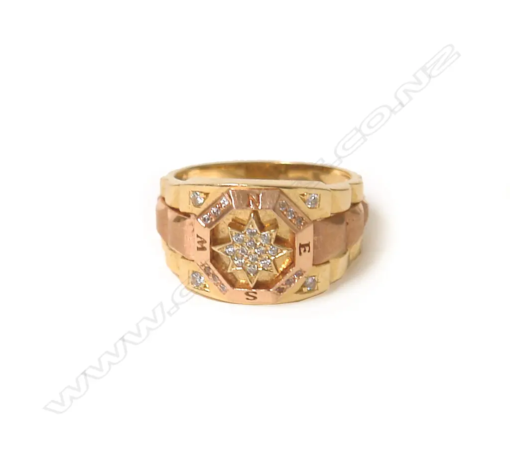 A 18ct. yellow and rose gold and diamond compass dress ring Image 1++