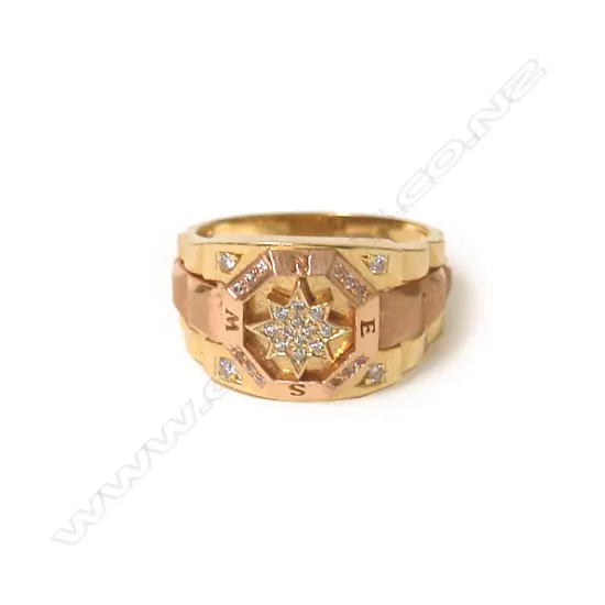 A 18ct. yellow and rose gold and diamond compass dress ring