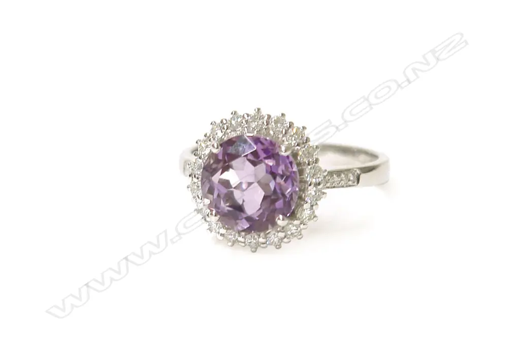 A modern 18ct. white gold amethyst and diamond cluster ring Image 1++