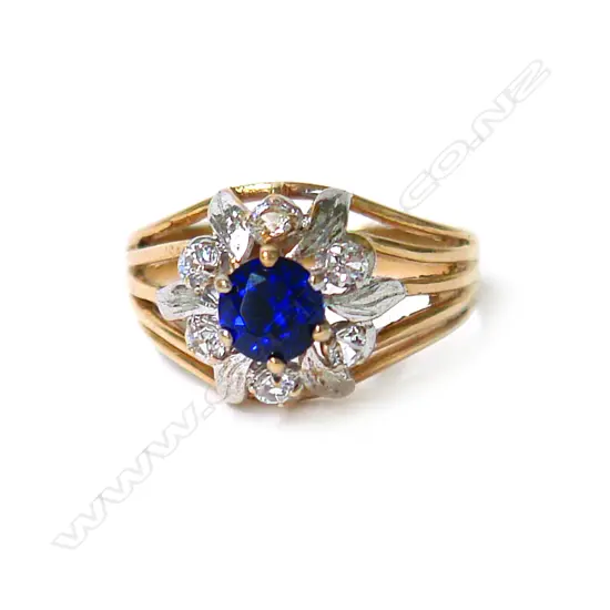 An 18ct. yellow gold sapphire and diamond cluster ring