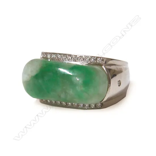 A modern large 18ct. white gold jadeite and diamond dress ring
