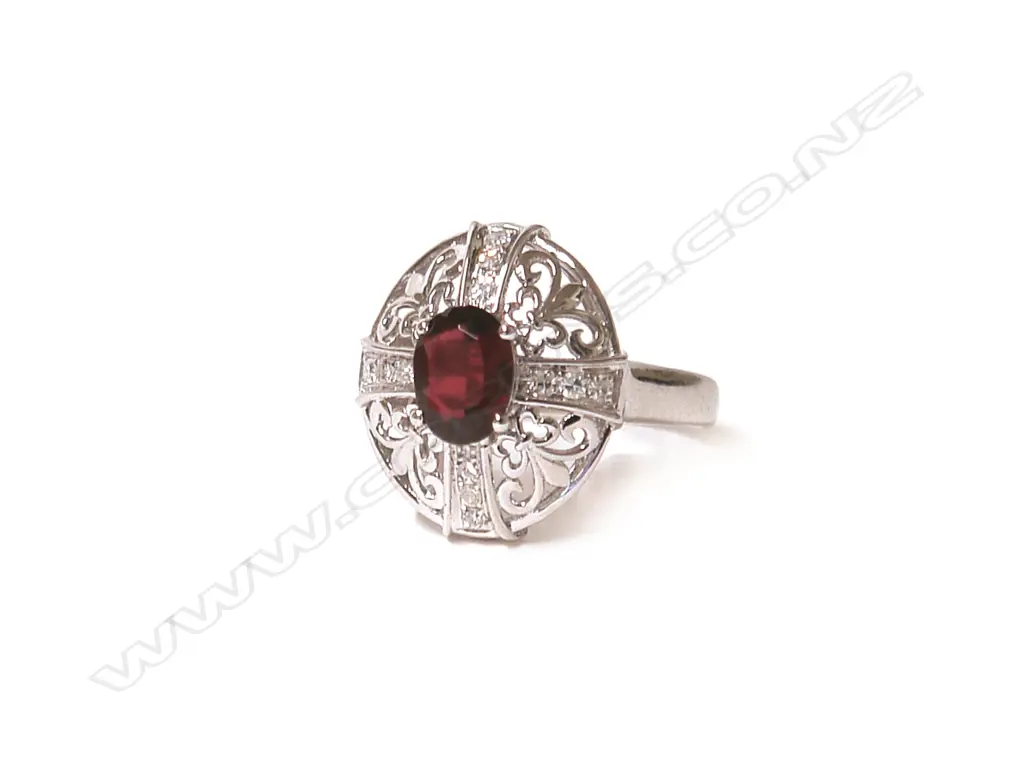 An 18ct. white gold ruby and diamond dress ring Image 1++
