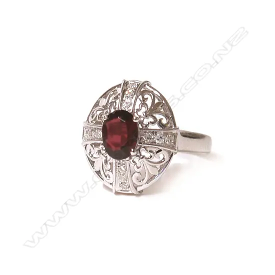 An 18ct. white gold ruby and diamond dress ring