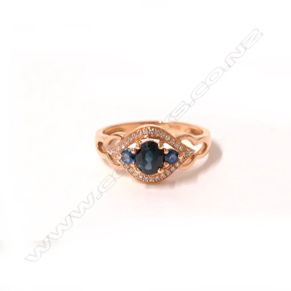 An 18ct. rose gold sapphire and diamond ring Image 1++