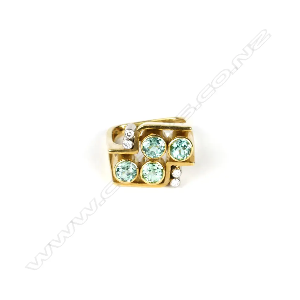 A retro 18ct. gold diamond and green gemstone ring Image 1++
