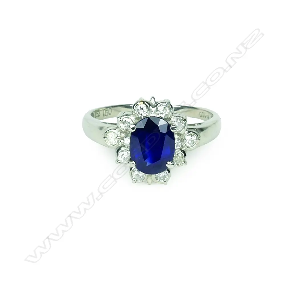 A platinum sapphire and diamond cluster ring Image 1++