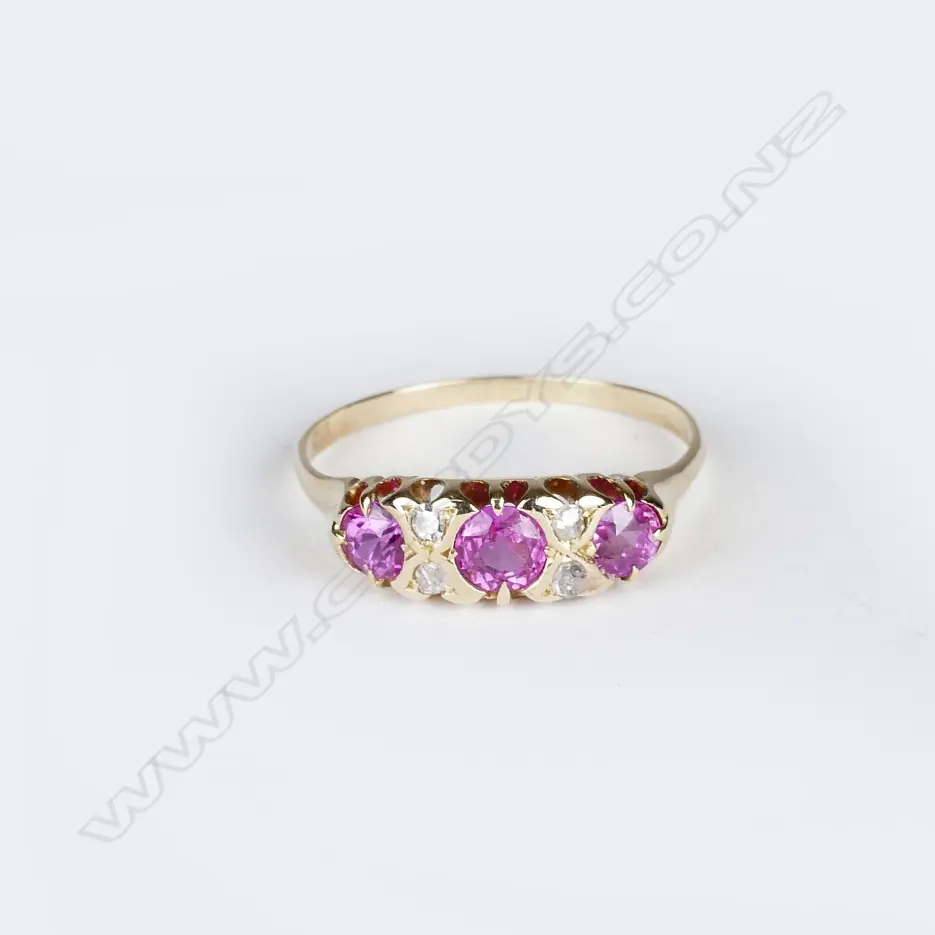 An 18ct. yellow gold pink sapphire and diamond ring Image 1++
