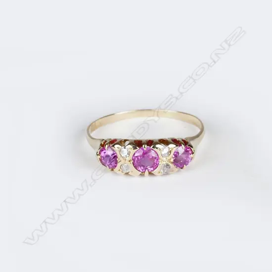 An 18ct. yellow gold pink sapphire and diamond ring