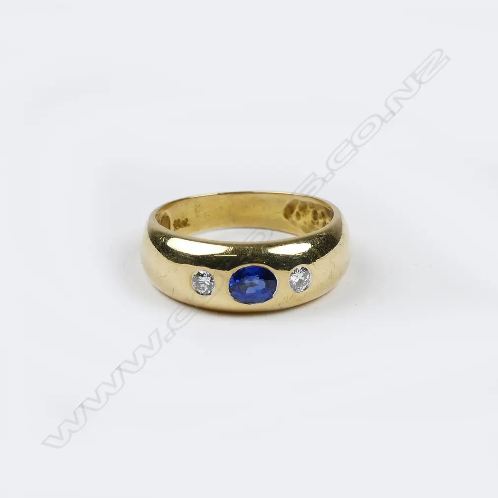 An estate 18ct. yellow gold sapphire and diamond gypsy style ring Image 1++