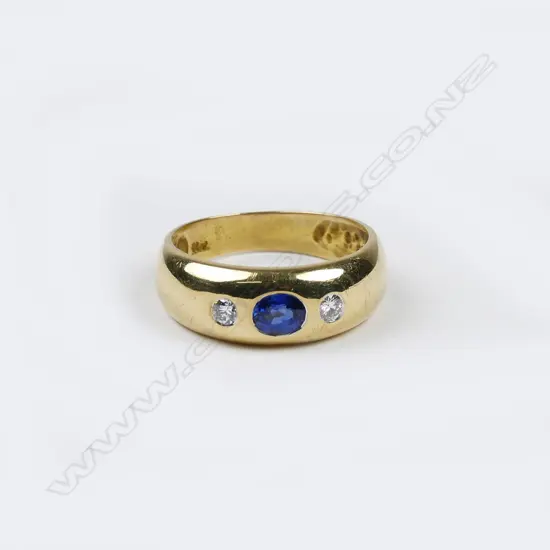 An estate 18ct. yellow gold sapphire and diamond gypsy style ring