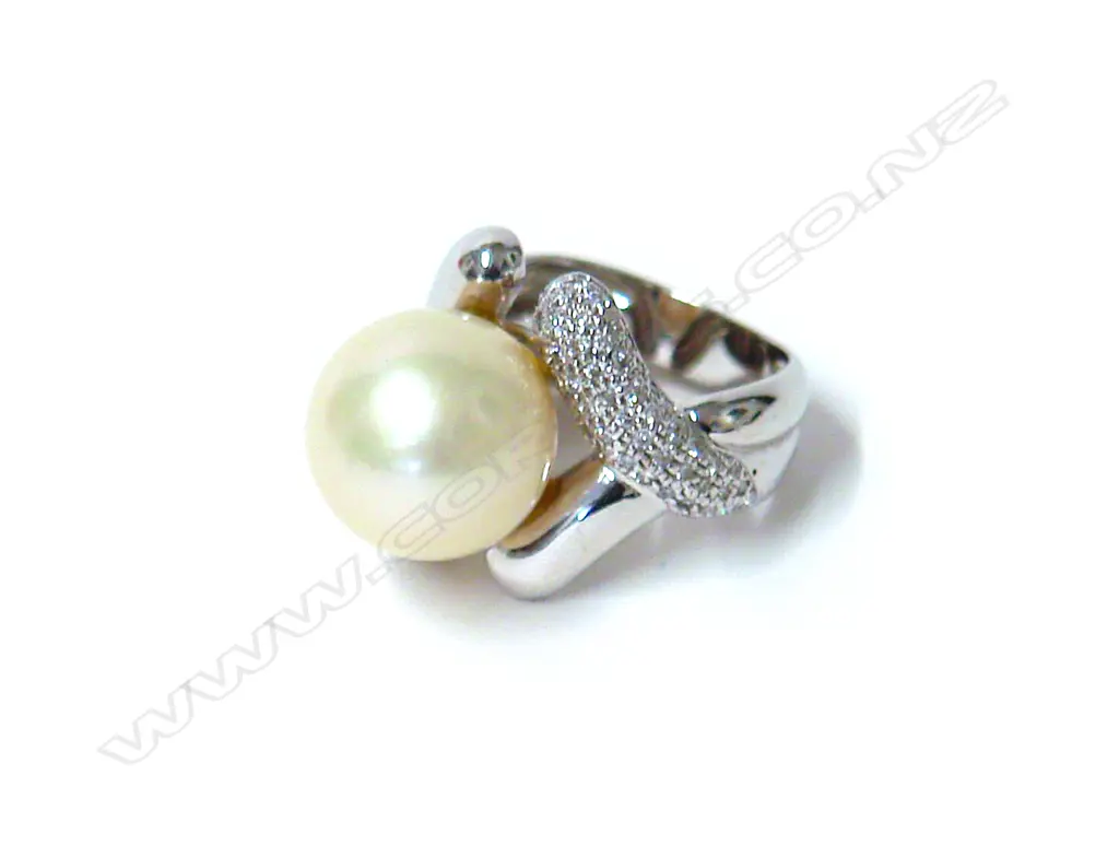 An 18ct. white gold diamond and cultured pearl dress ring Image 1++