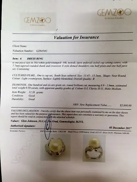 An 18ct. white gold diamond and cultured pearl dress ring Image 1++