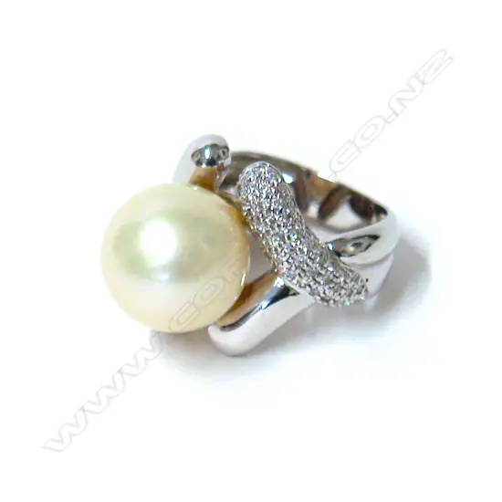 An 18ct. white gold diamond and cultured pearl dress ring