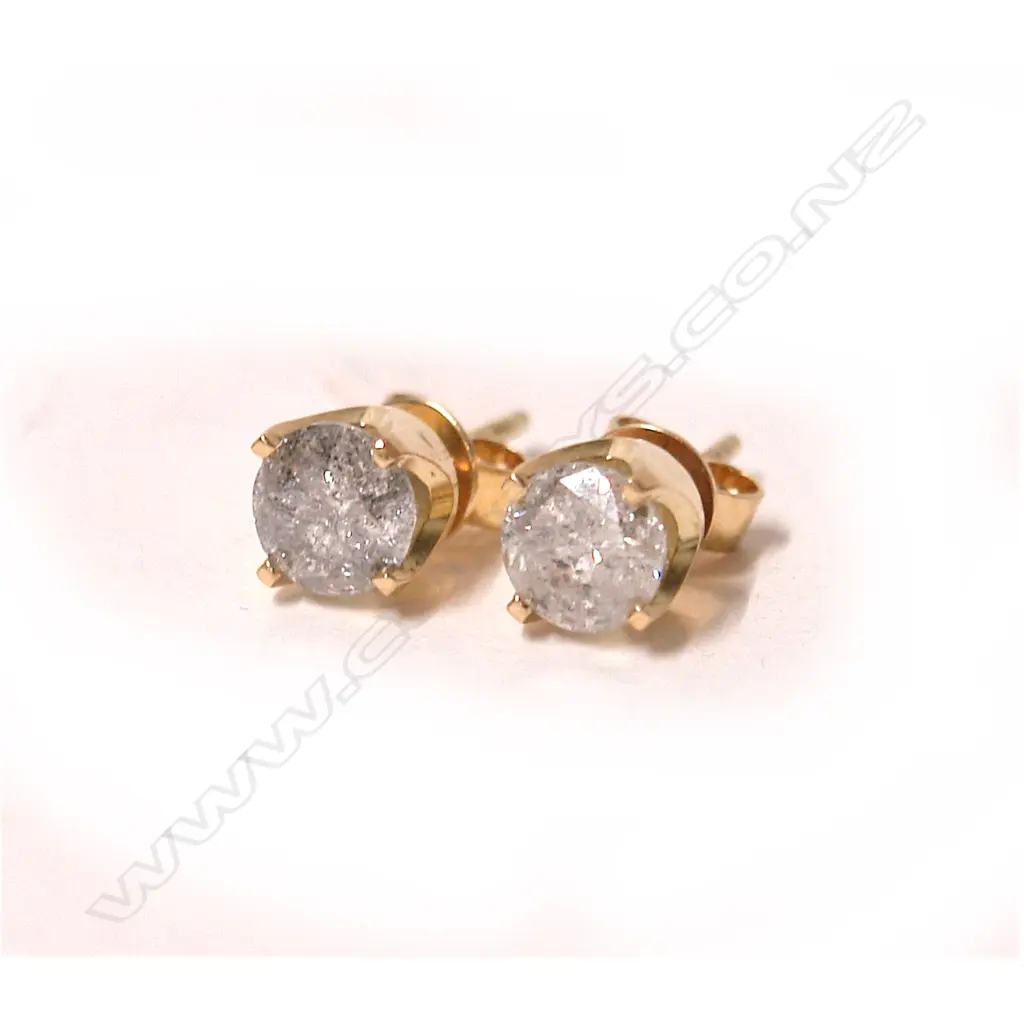 A pair of large modern brilliant cut diamond solitaire earrings in 18ct. yellow gold Image 1++
